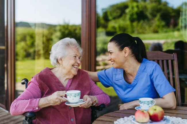 Connecticut assisted living planning: Elderly resident with caregiver in a safe and comfortable facility