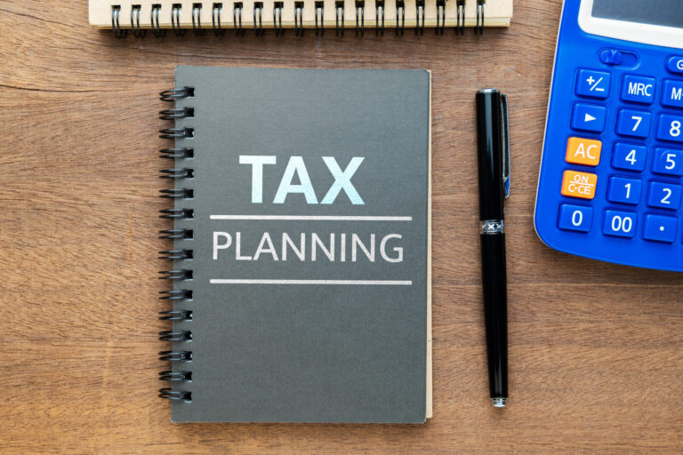 Tax Planning on a small notebook Review your estate plan at tax season
