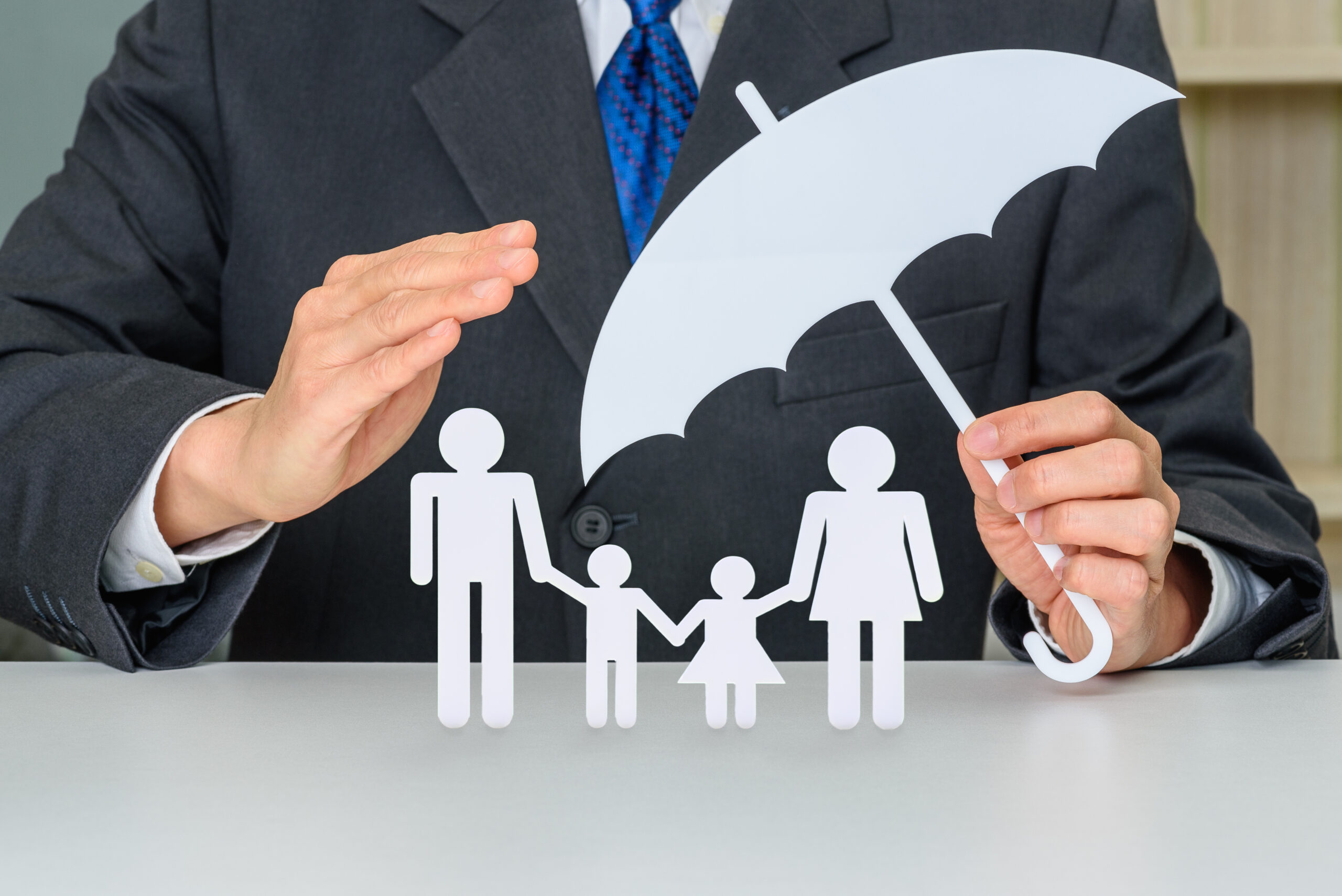 Businessman protects family members e.g parents and two child Estate planning & elder law specialist